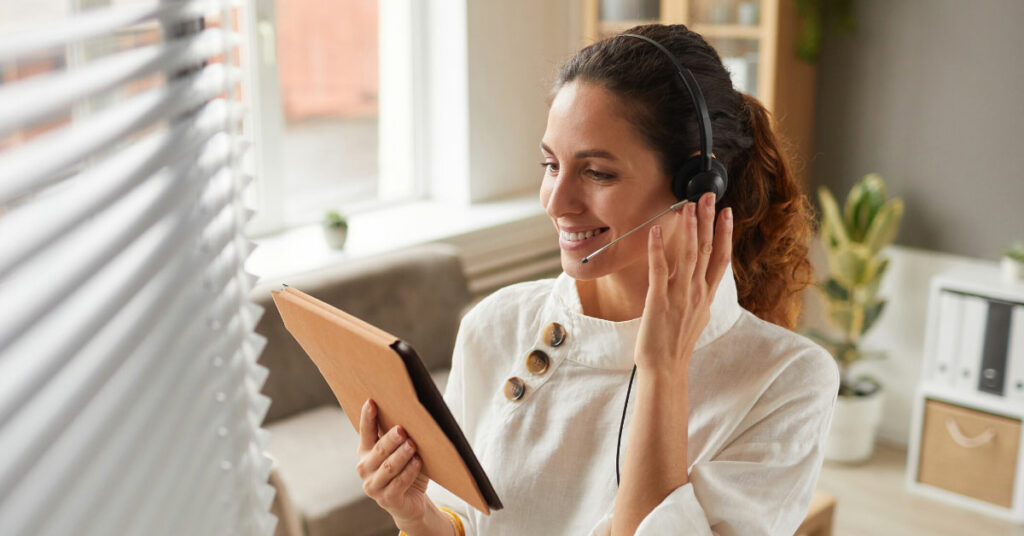 Virtual Assistant from Anequim talking on her customer service headset.